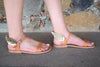 Leather sandals with wings